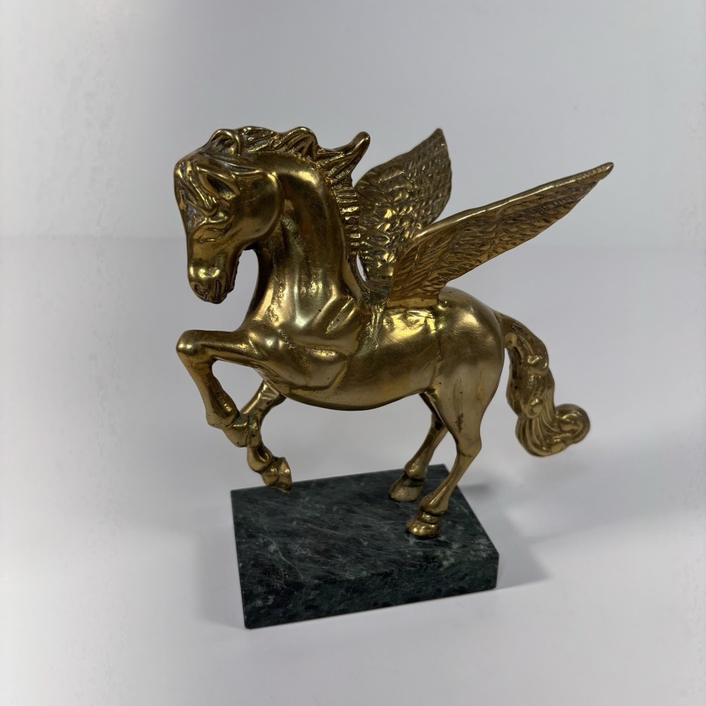 vintage solid brass Pegasus figurine mounted on a green marble base,